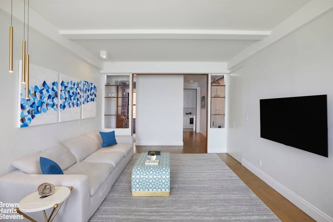 This beautifully renovated three bedroom, two bathroom co op on the upper west side seamlessly blends classic prewar charm with modern luxury.