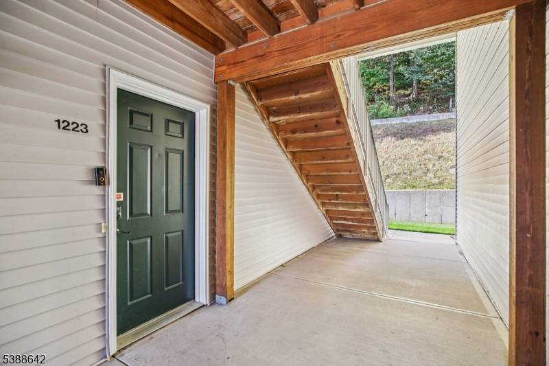 Meticulous, move in ready second floor end unit condo featuring luxury vinyl flooring throughout main living areas.