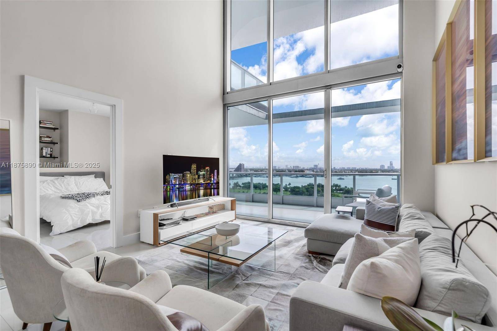 Live in the heart of it all with extraordinary Downtown Miami luxury the highest 2 story residence in the building, rising above Biscayne Bay and Miami World Center.