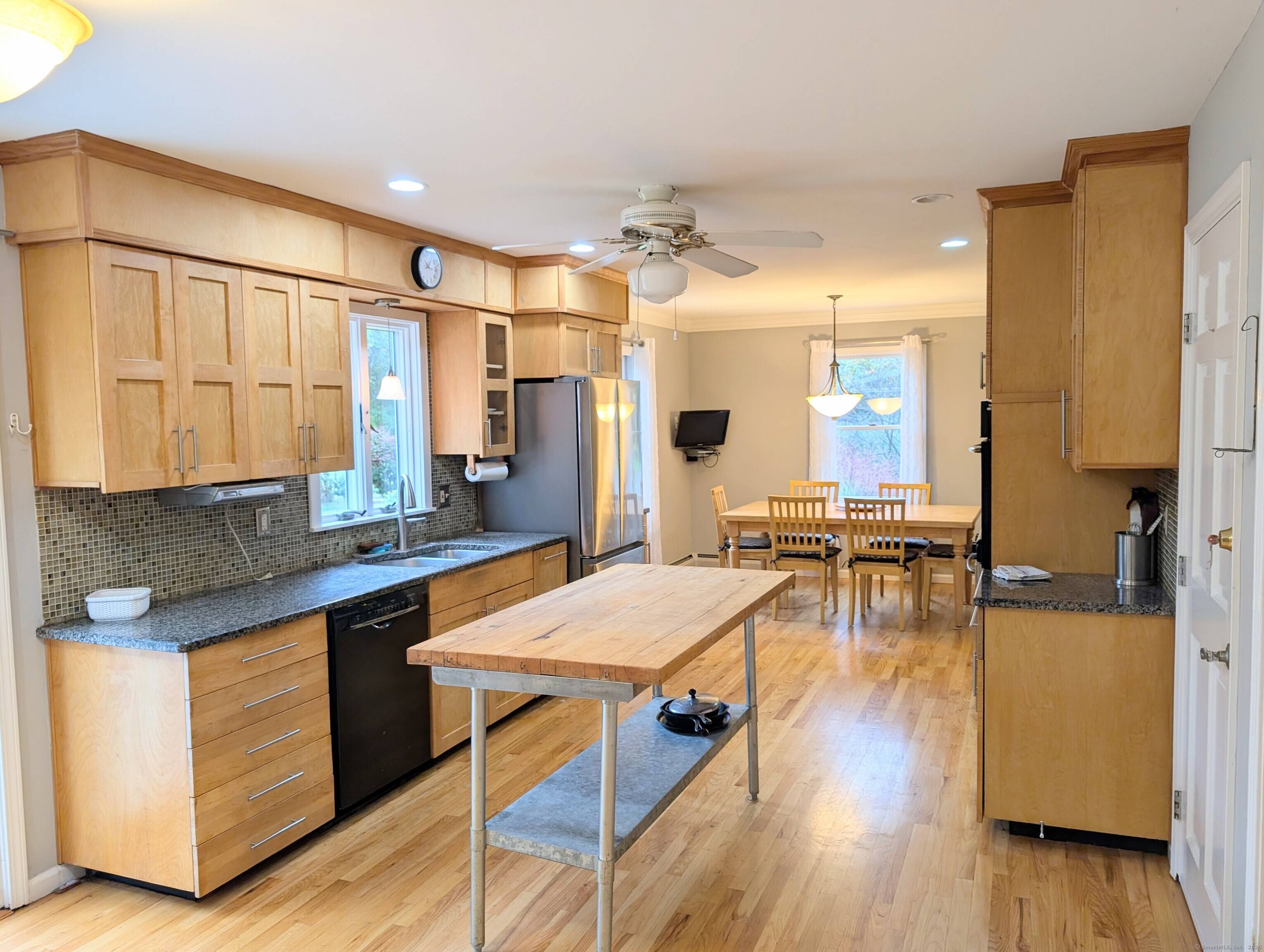 Home Sweet Home ! This eye catching Gambrel Colonial sits attractively on a lush, green acre in Sandy Hook, CT just 90 minutes from NYC !