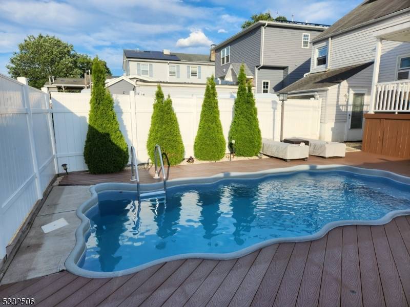 Custom Split level featuring spacious living room, modern e i kitchen, 3 bedrooms,, 3 full baths recreation room walkup attic with jacuzzi, attached garage plus two outside parking spaces, finished ...