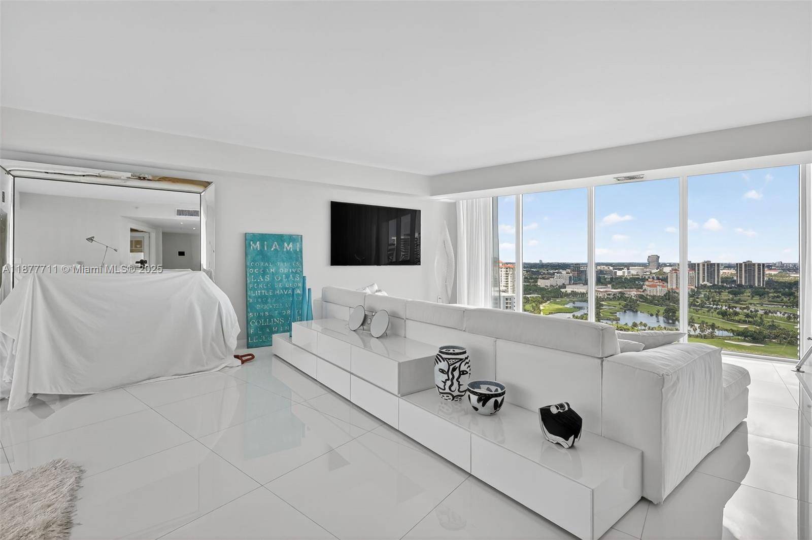 Wow ! Enter from semi private elevator foyer to this 100 renovated white light bright masterpiece !