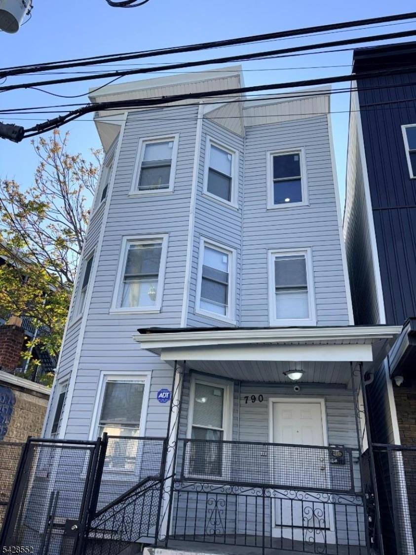 COMPLETLEY REHABED 3 FAMILY HOME.
