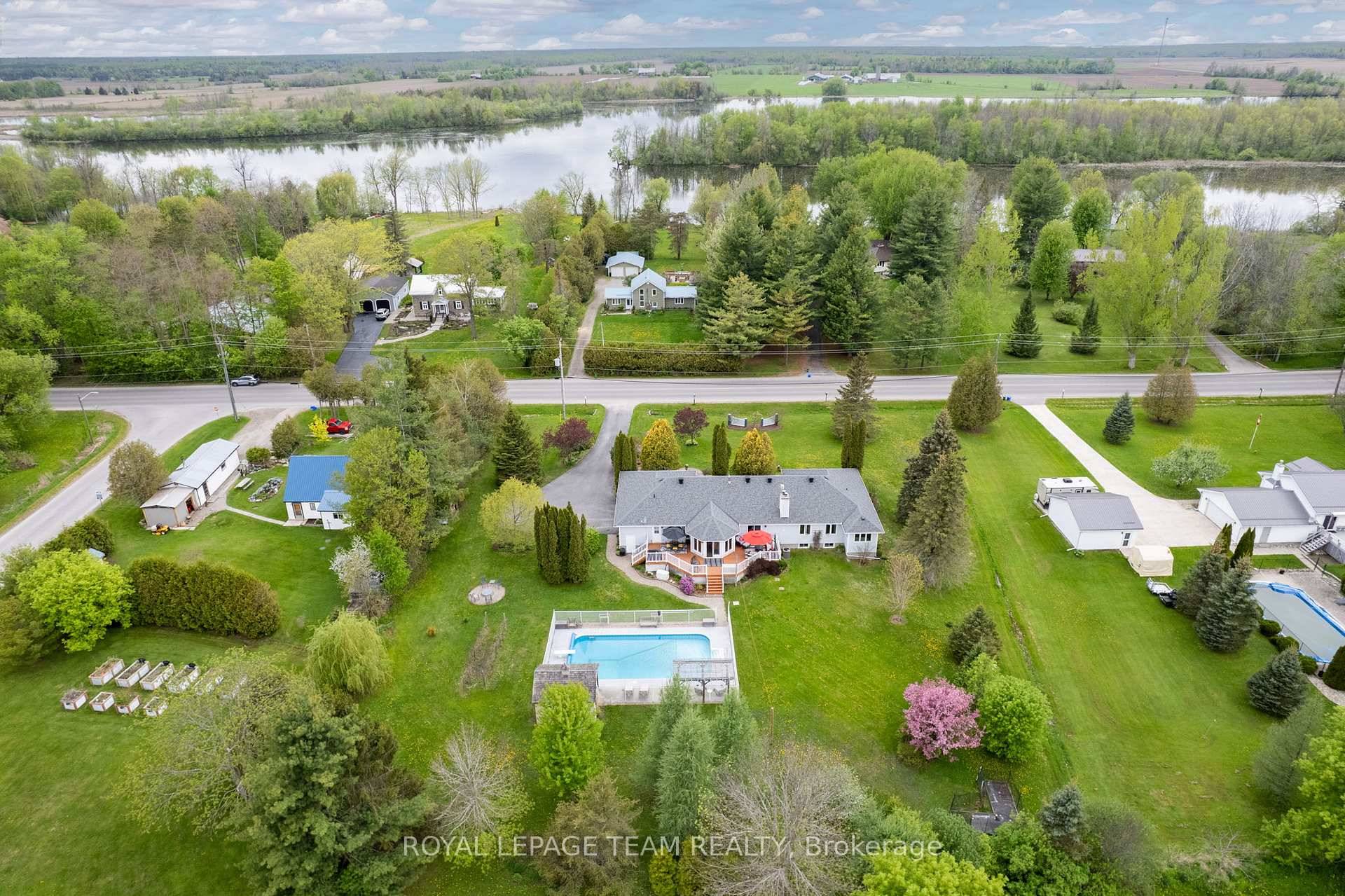 Across from the scenic Rideau River and set on a beautifully landscaped 1.
