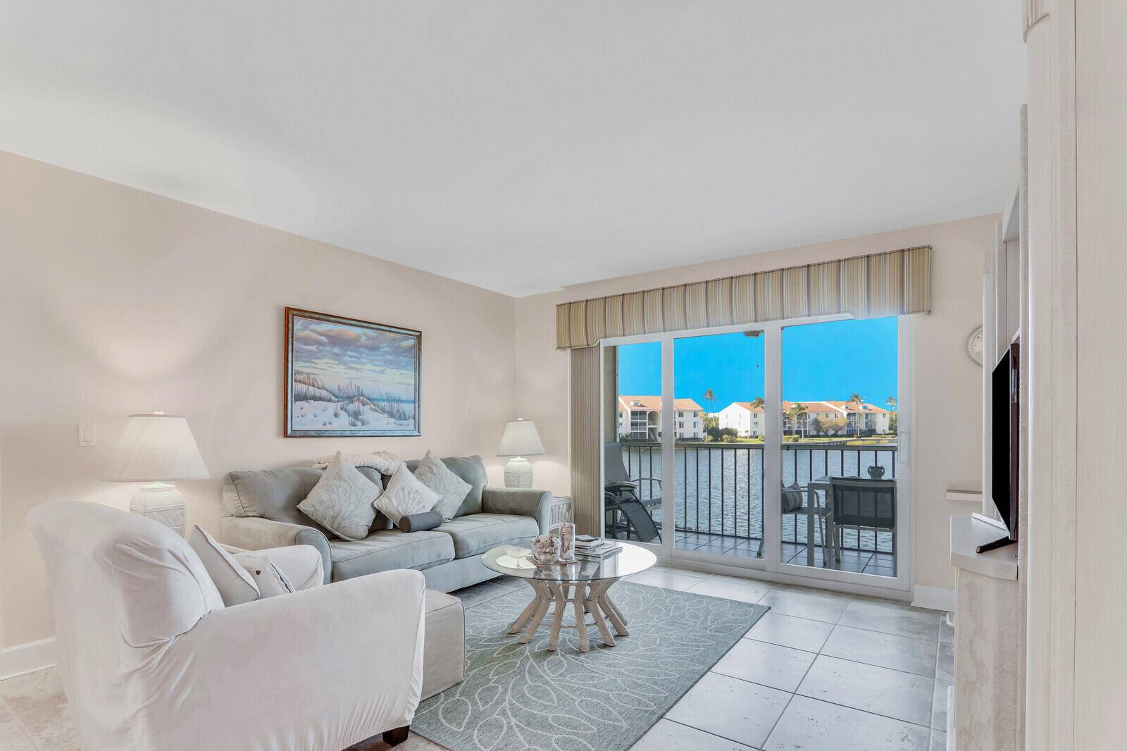 PRICE REDUCED Absolutely the Best 2nd Floor Condominium with a spectacular Lake view and just steps to the community pool !