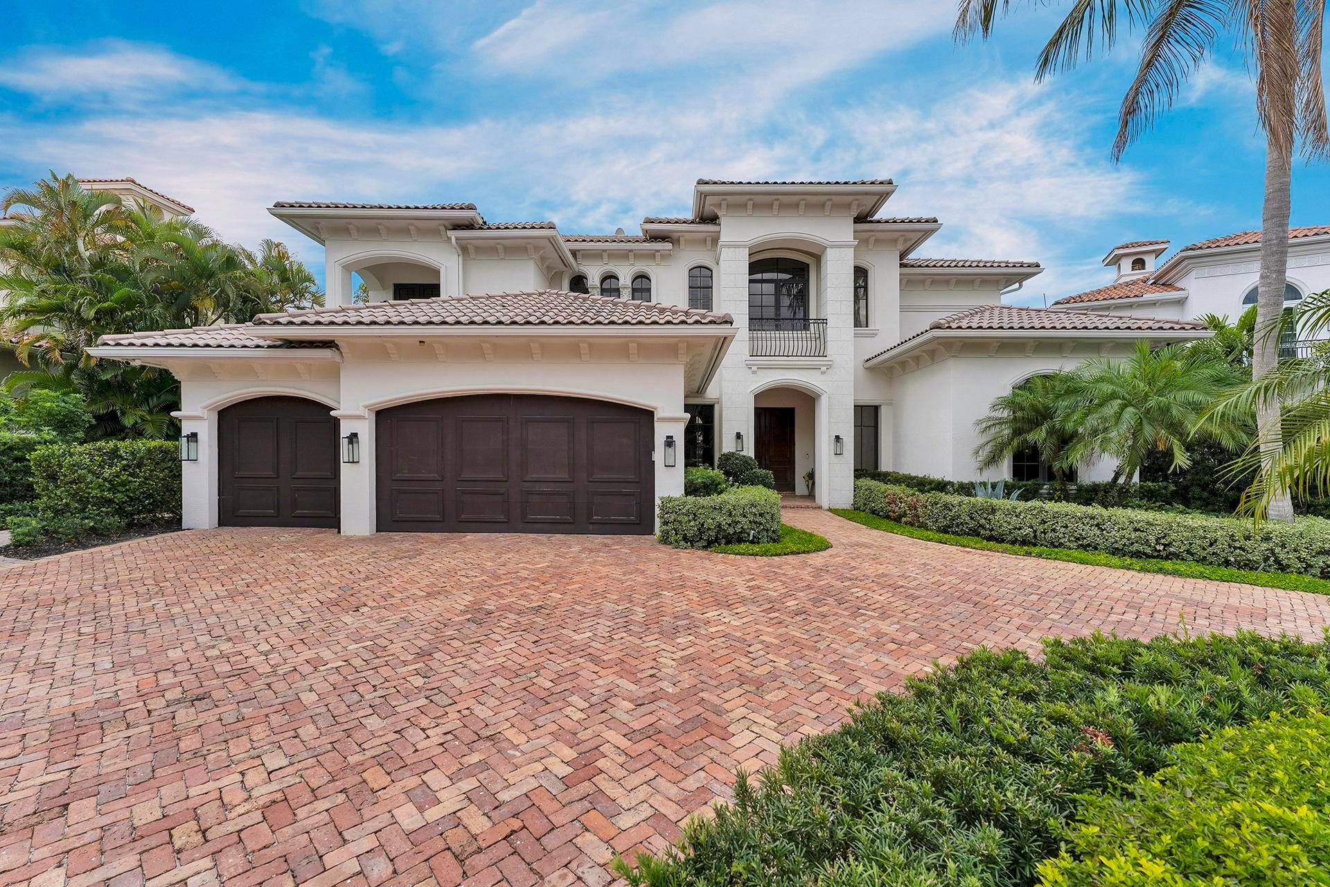 Experience refined luxury in this custom expanded Carlton estate, perfectly positioned on the most exclusive cul de sac lot within the prestigious gated community of The Oaks in Boca Raton.