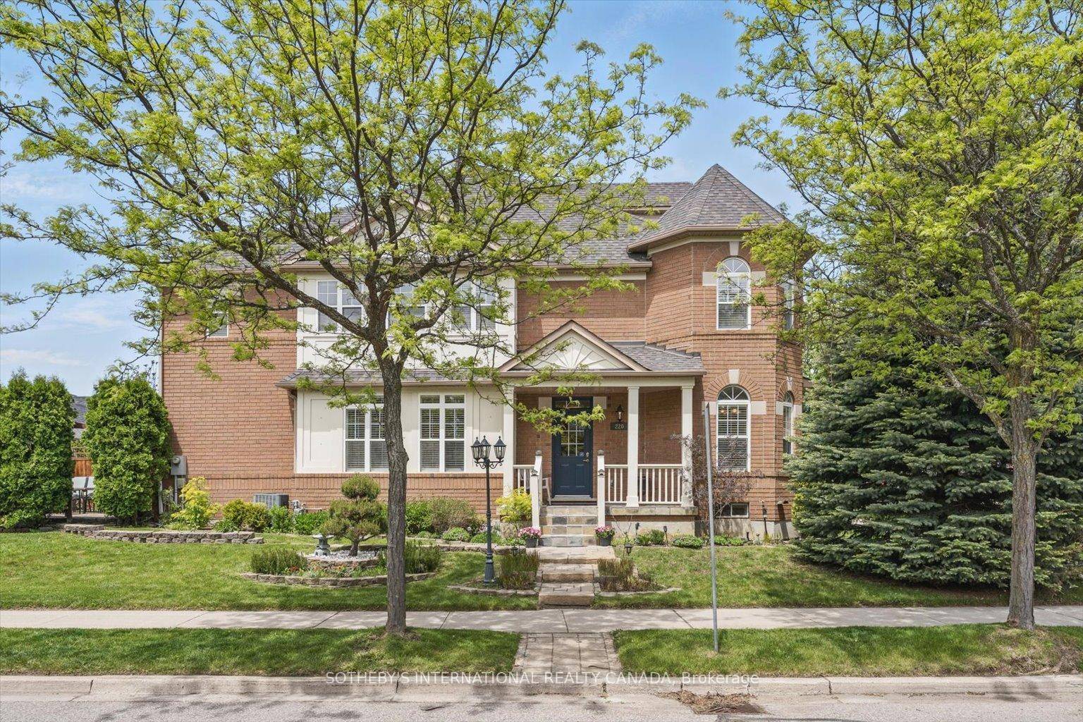 Set on a rare corner lot, adorned with stunning perennial maintenance free gardens and two majestic blue spruce trees.