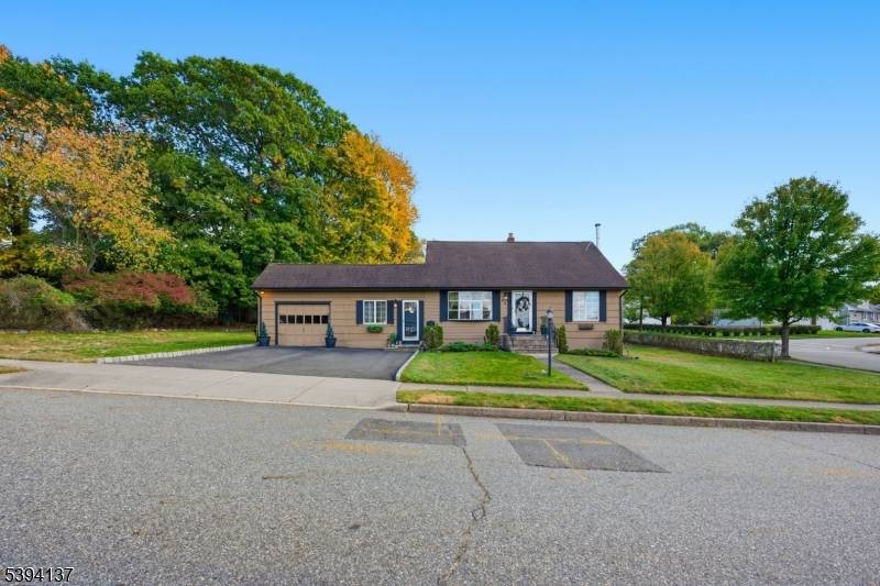 Charming and well maintained 3 bedroom, 1 bath Cape situated on a beautiful corner lot in a desirable residential neighborhood in Woodland Park !