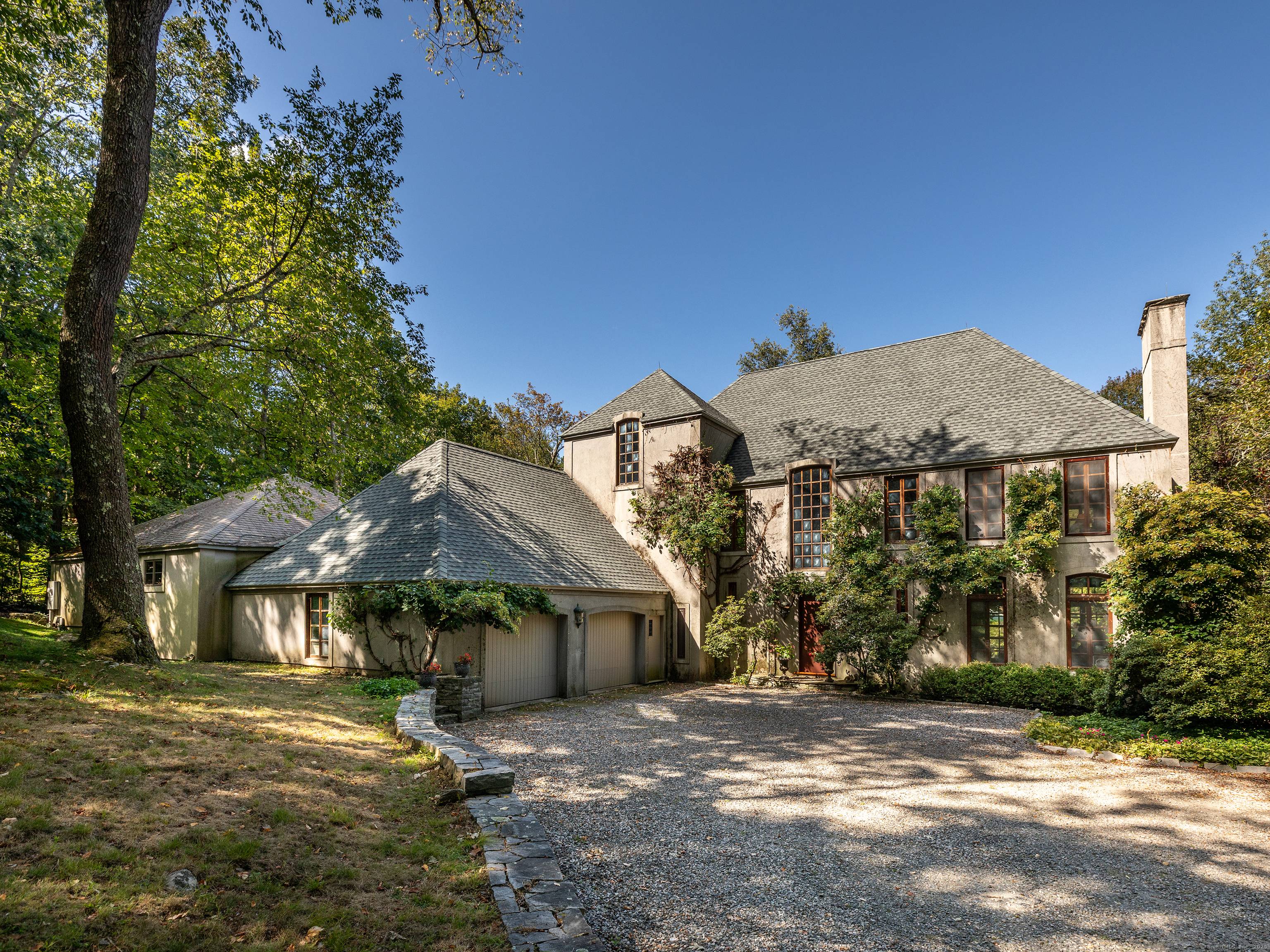 Perfect country home impressively set in private location abutting White Memorial land trust and vineyard.