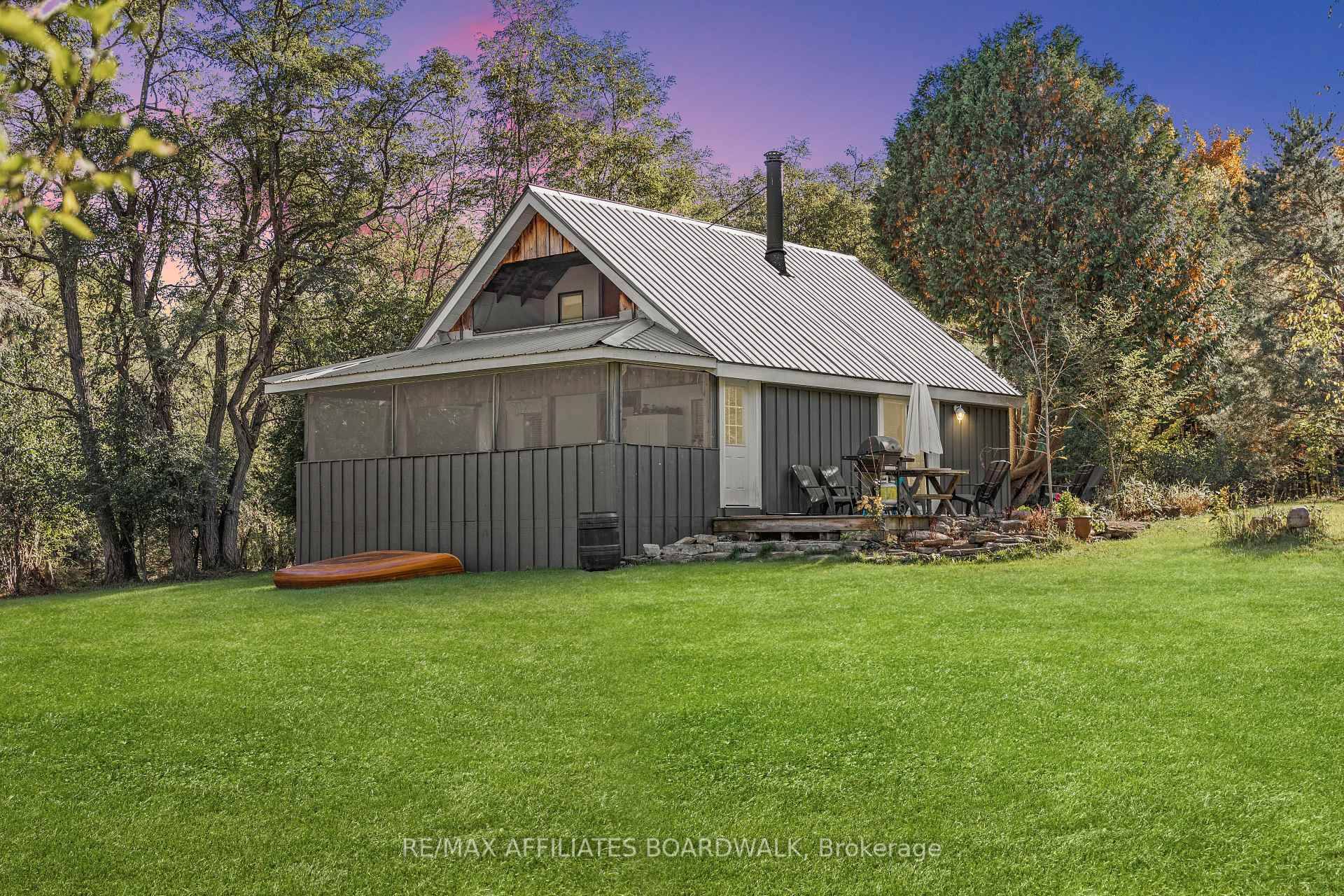 Nestled in the heart of Rideau Lakes, this charming cottage retreat sits on just over 7 acres of beautifully manicured land surrounded by towering maples and pines.