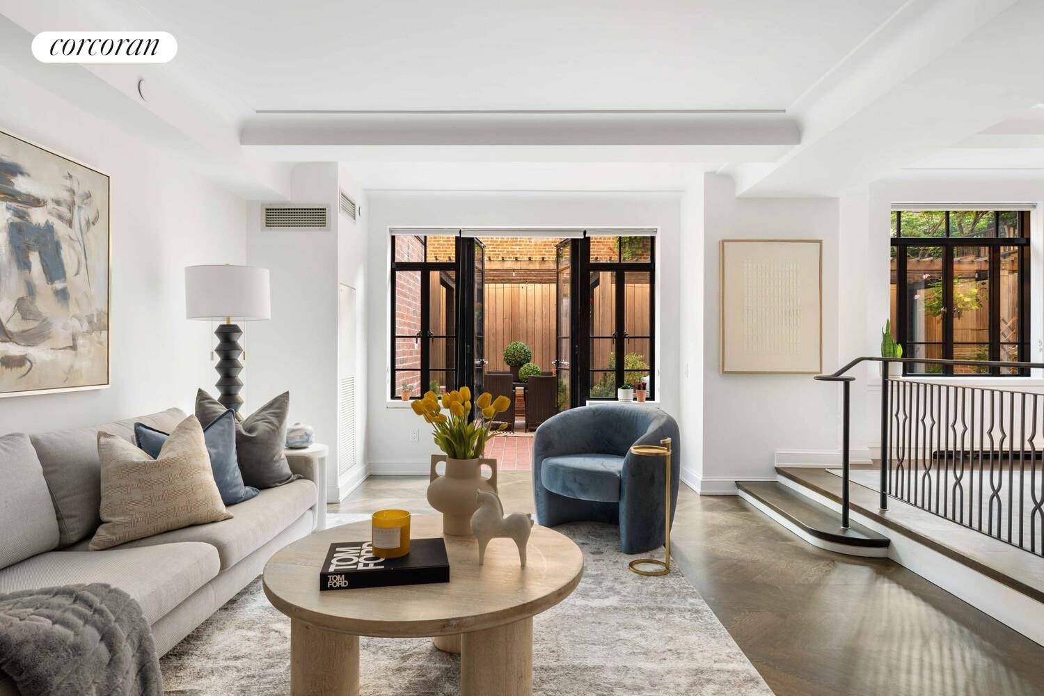 Welcome to 130 West 12th Street, Apartment 1A, a private garden level retreat within one of the Village's most architecturally preserved stretches.