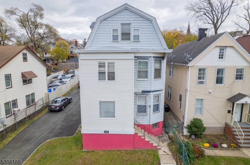 Well appointed 3 level, two family residence offering timeless charm and exceptional potential.