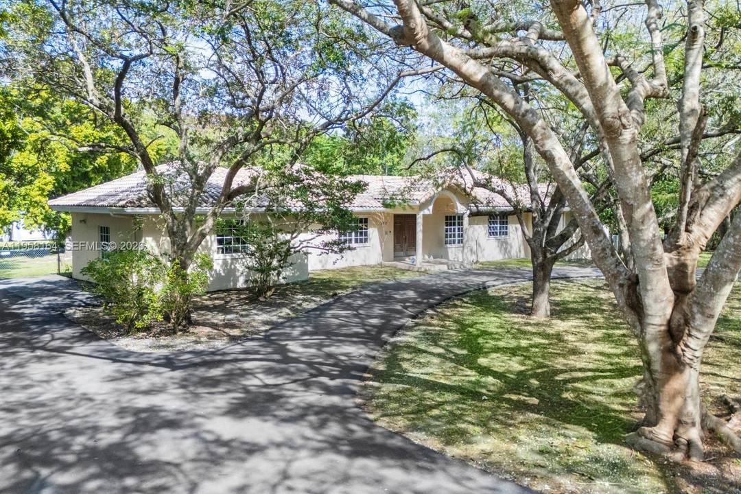 Opportunity Knocks ! Beautiful and expanded family home located on a fantastic acre on a quiet low traffic Pinecrest street.