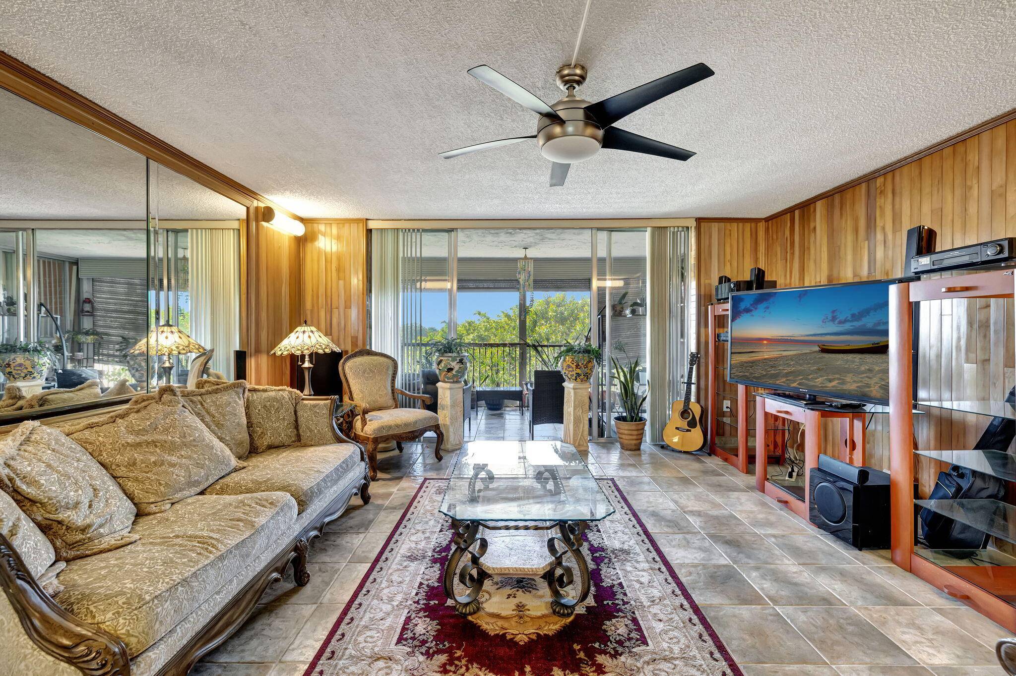Expansive 3 bed, 2 bath condo offering 1, 750 sq ft of living space with large rooms throughout, including an oversized primary bedroom that opens to a serene, enclosed balcony.