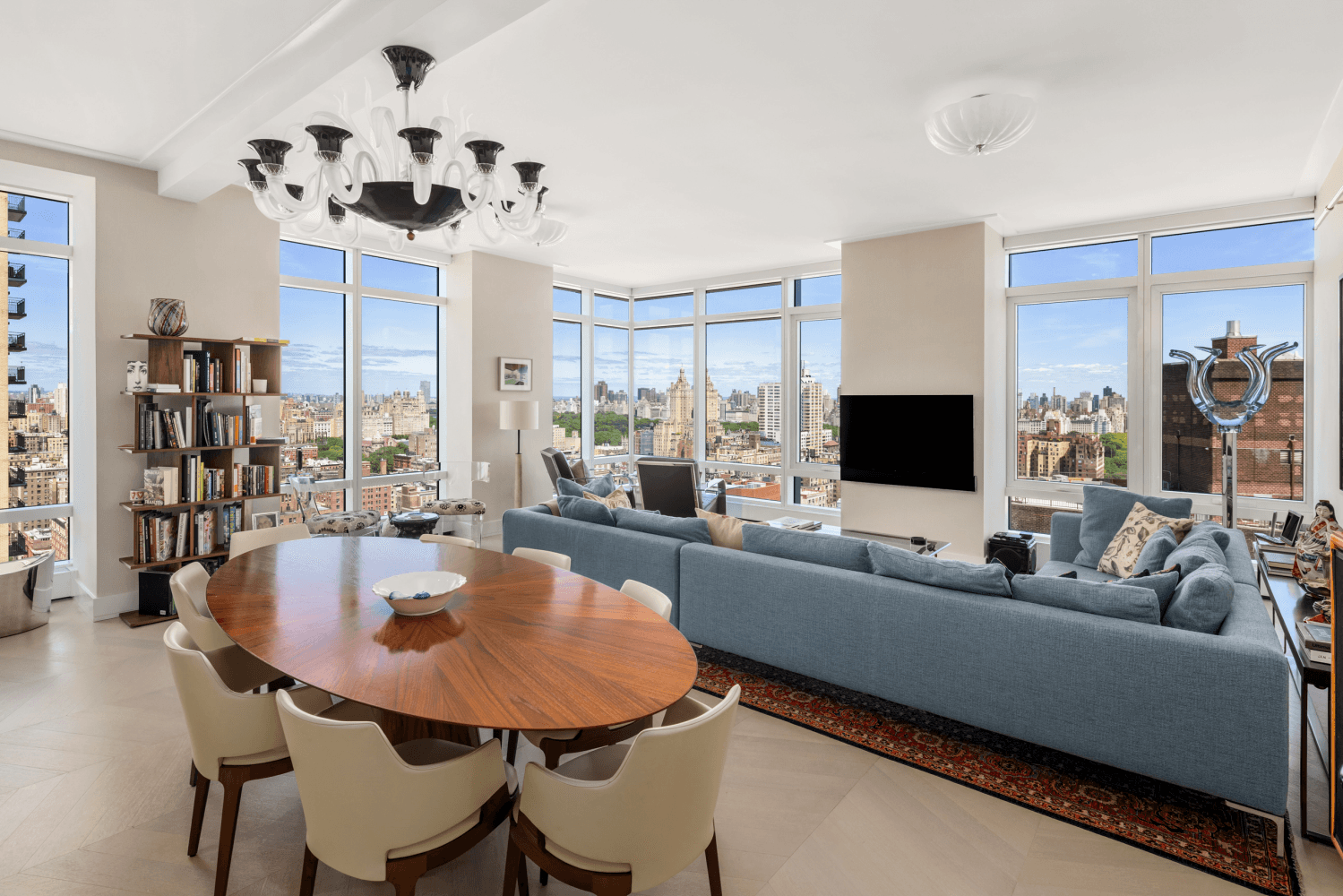 This triple mint 2, 092 square foot residence blends the grandeur of a pre war loft with the light and views of a modern tower.