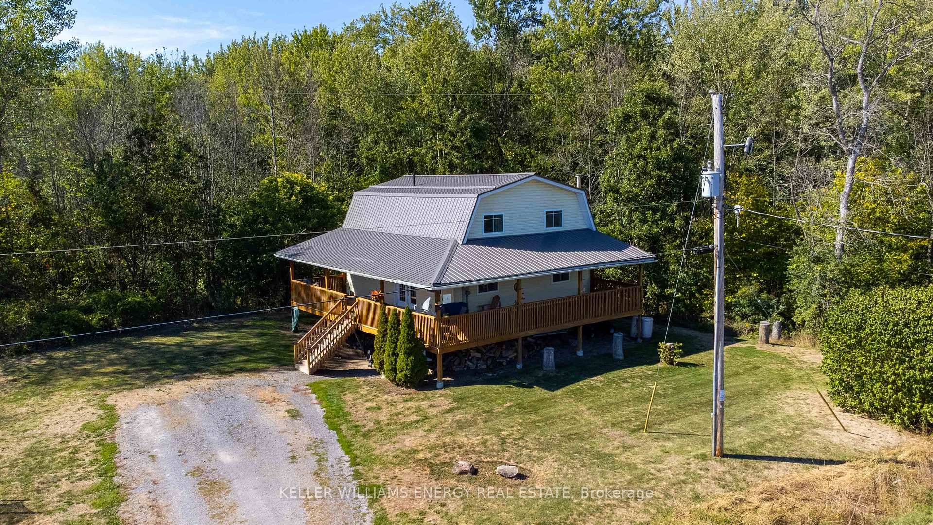 Escape to nature without sacrificing modern comforts in this beautifully updated two storey farmhouse nestled on 12 acres of protected forest in the heart of Prince Edward County.