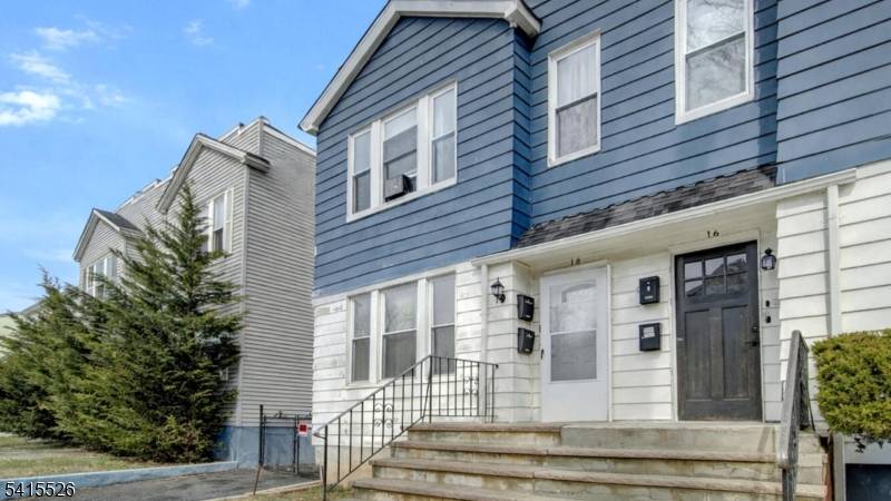 Stylishly renovated 2 Family Duplex on a charming tree lined street !
