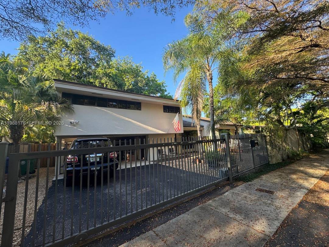 Discover the ultimate North Coconut Grove lifestyle with this exceptional 3 bedroom, 2.