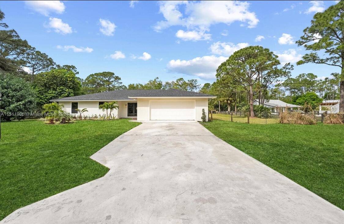 MOTIVATED SELLERS Welcome to this fully renovated oasis in the heart of Jupiter Farms !