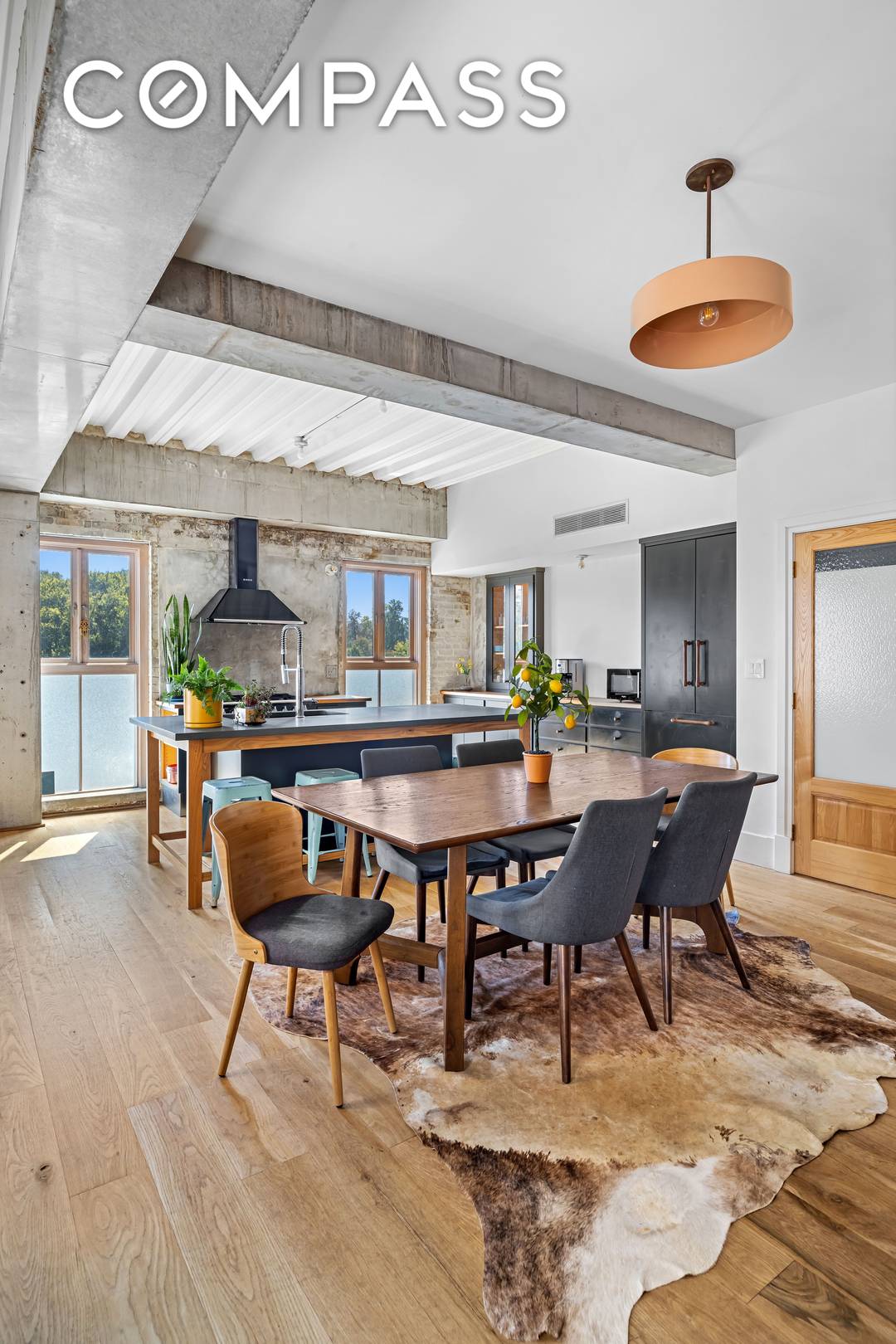 This single family house unfolds over five levels with a rare private parking space, two terraces, and a modern industrial aesthetic unlike anything else in Brooklyn.