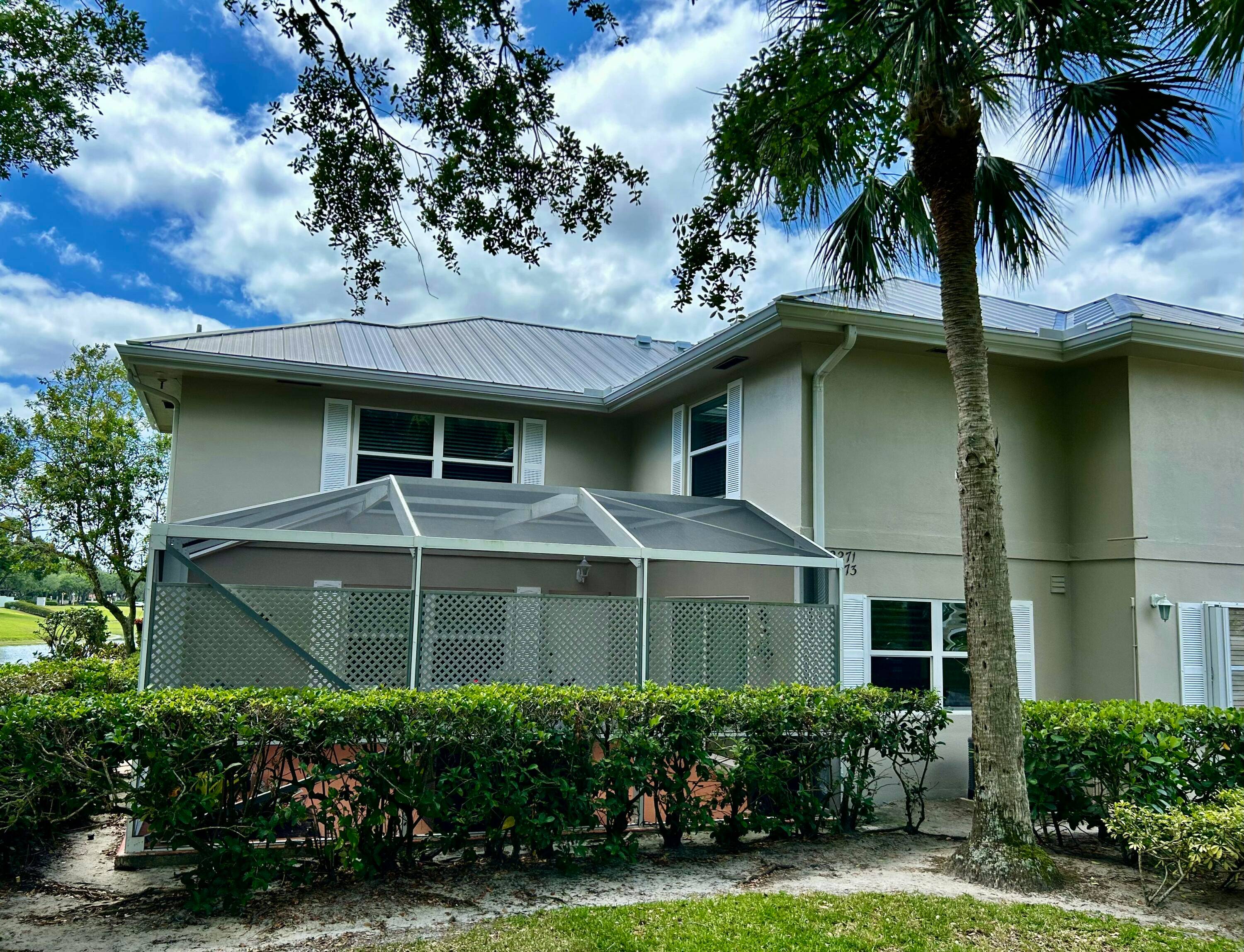 This spectacular townhome is located in The Meadows at Martin Downs.