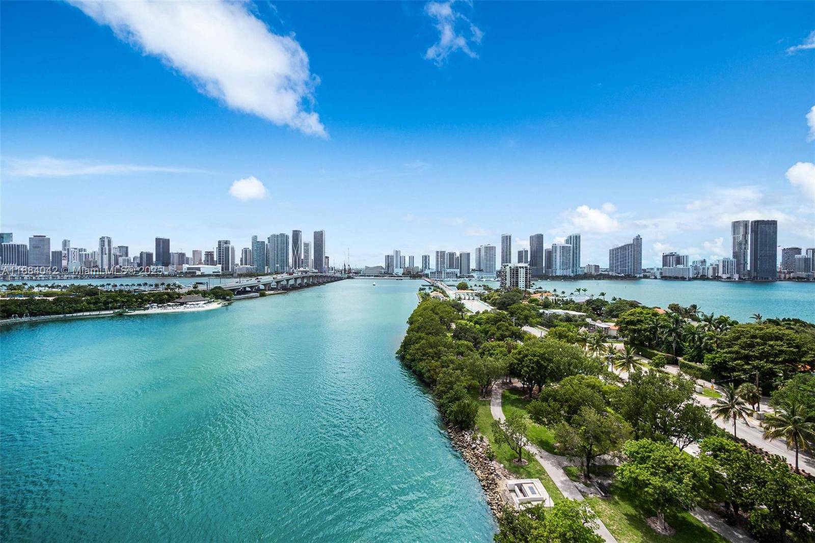 Step into a Manhattan meets Miami masterpiece a sleek 2 story residence with jaw dropping, unobstructed bay skyline views.