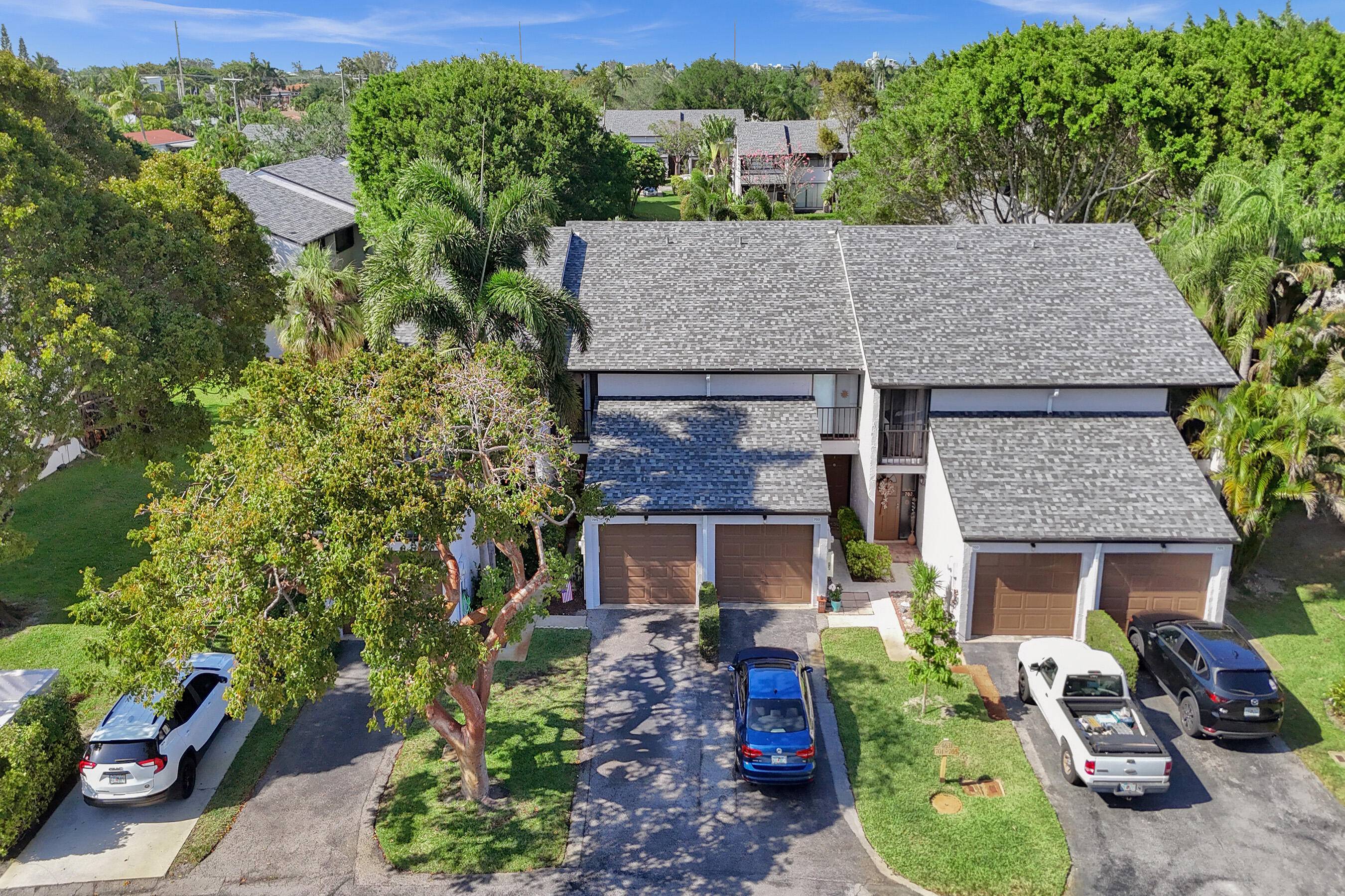 Modern 2 bed loft East Boca townhome with a 1 car garage is a hidden gem in an incredible location less than two miles from the beach.