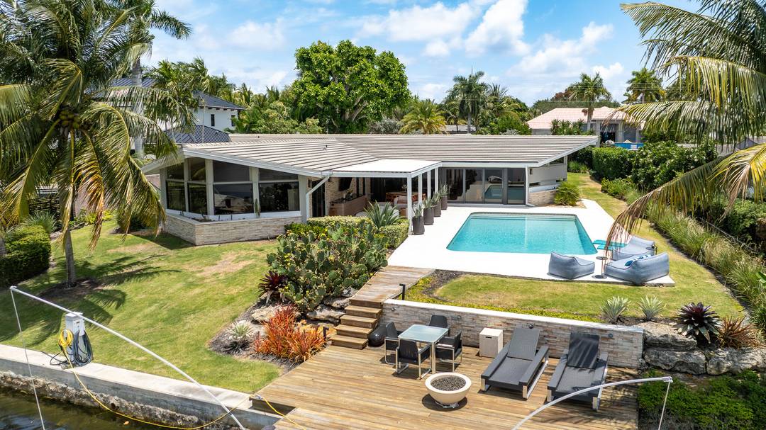 Situated on the Middle River, in the charming neighborhood of Coral Ridge, this home is a one of a kind, mid century modern masterpiece.