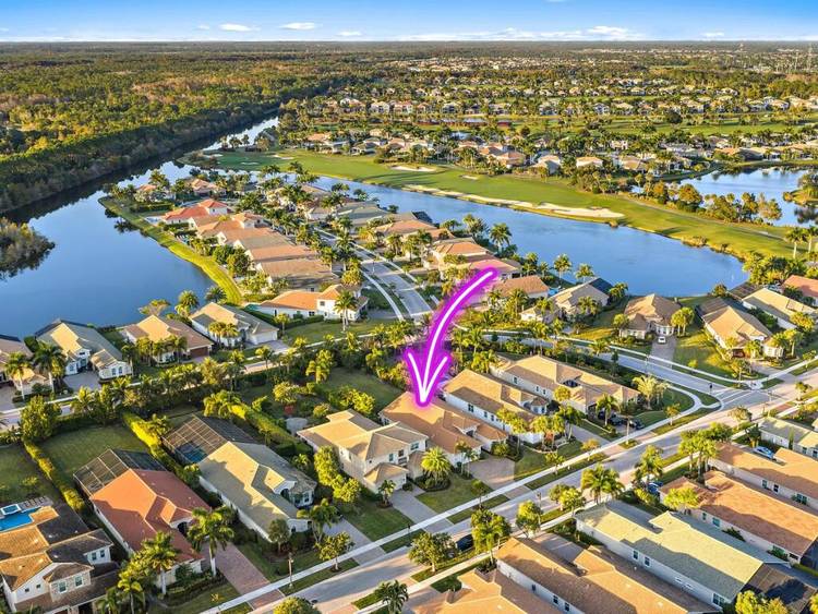 Located within the prestigious gates of Jupiter Country Club, this Extended Saranac model single family residence features 3 bedrooms plus an office, 3.