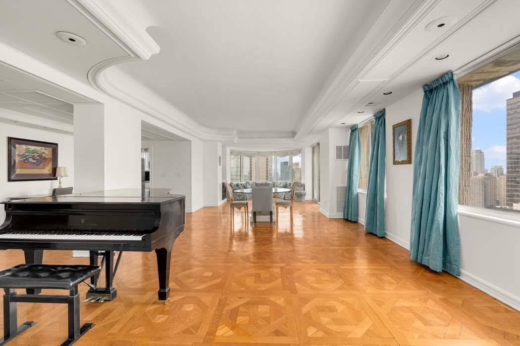 Soaring Above the City Penthouse Elegance with Sweeping Views of Central Park, Lincoln Center amp ; the Hudson River Perched on the 31st floor high above Manhattan, this expansive, sun ...