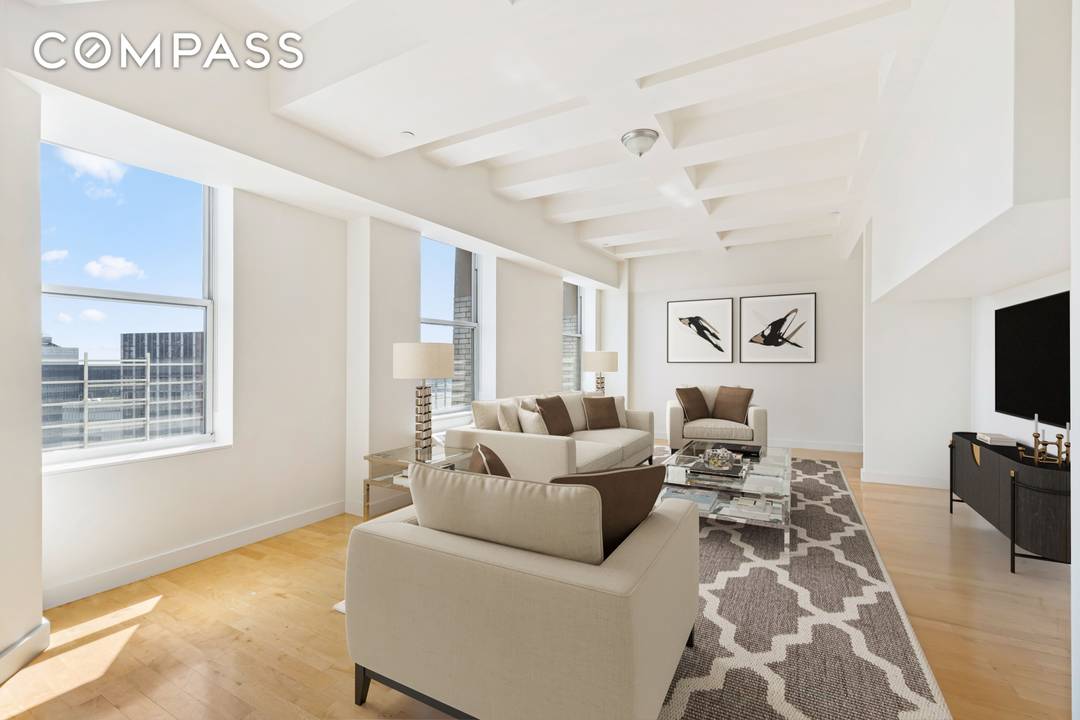 Welcome to an exquisite duplex penthouse located on Broad Street in Manhattan's iconic Financial District.