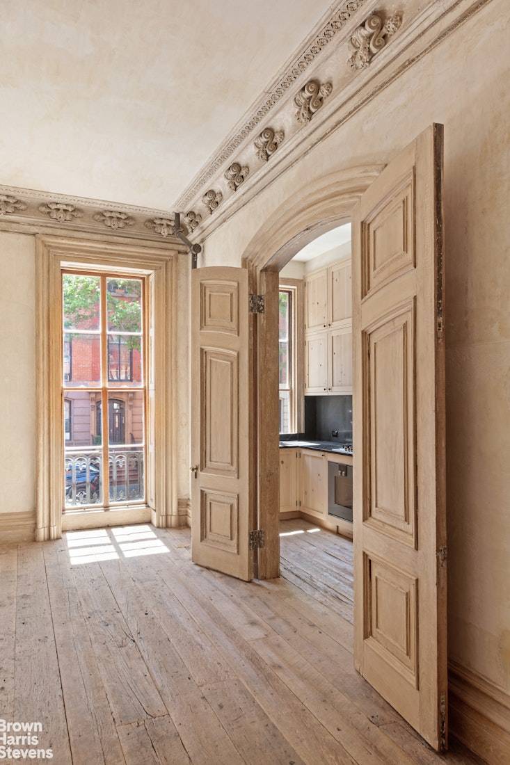 This rare and meticulously restored triple parlor residence is located within a landmarked 19th century townhouse on one of the most picturesque tree lined blocks in the East Village and ...