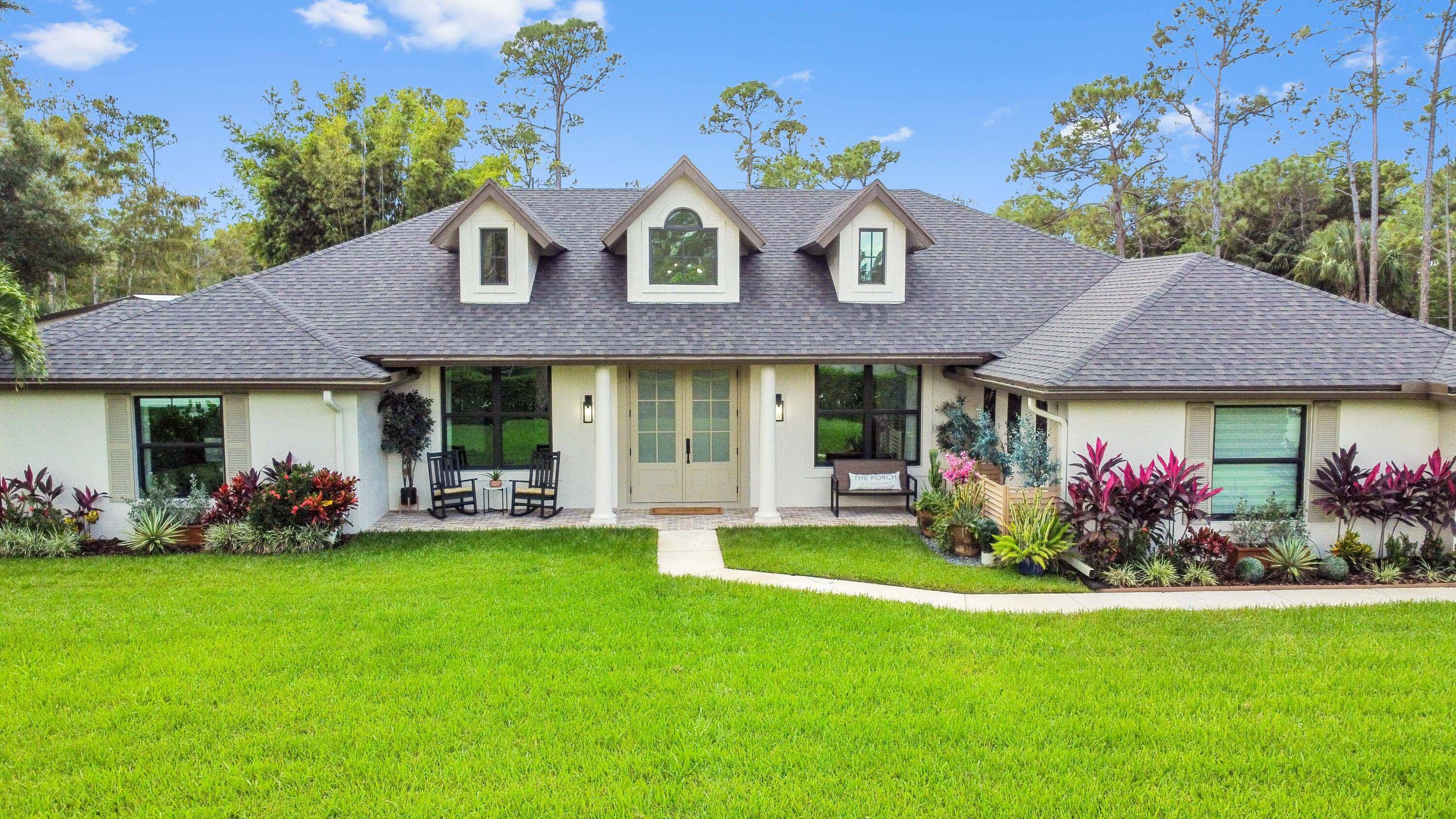 The search for your dream home ends here with this exceptional ranch, a fully upgraded sanctuary in The Acreage that leaves nothing to be desired !
