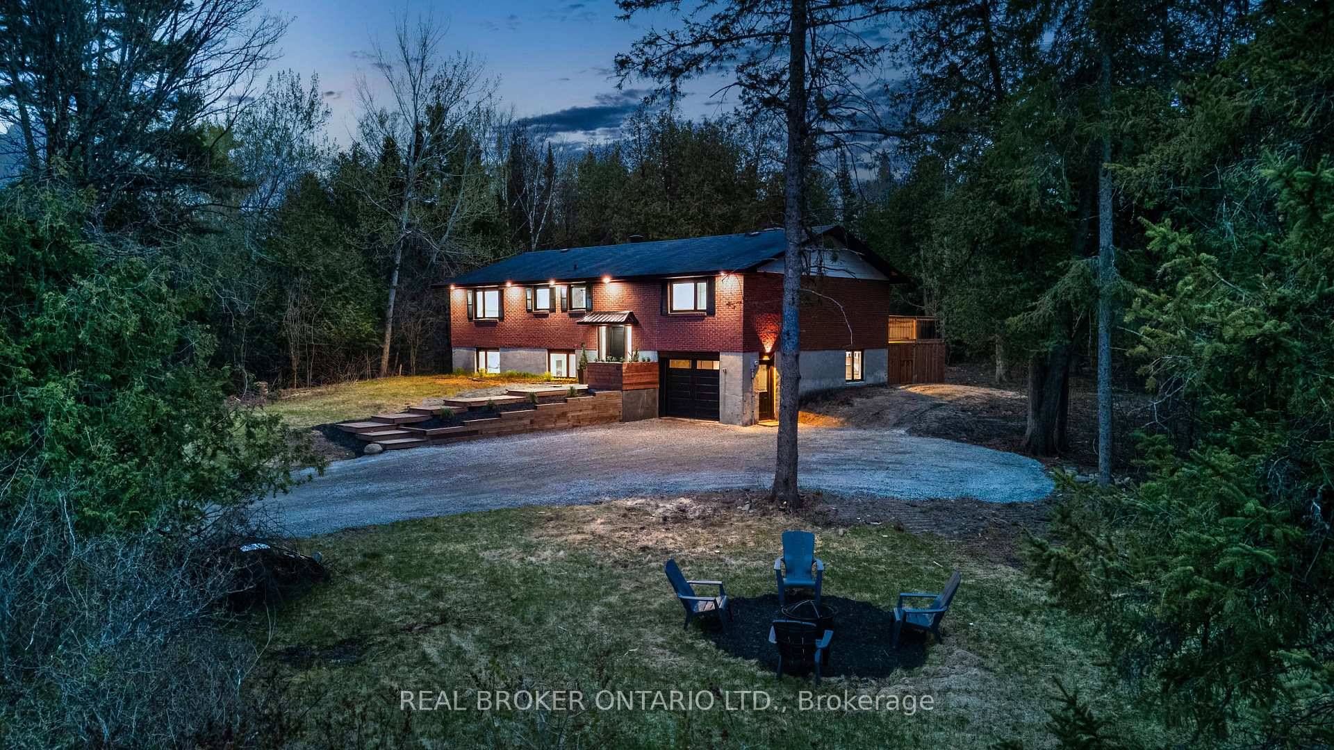 Welcome to this updated 5 bedroom split level brick home, tucked away on a private, treed 2.