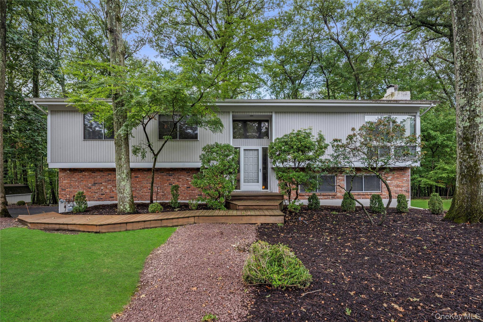 Don t miss this Contemporary Raised Ranch featuring soaring cathedral ceilings with exposed beams, spotlights, skylights, and an abundance of closet space.