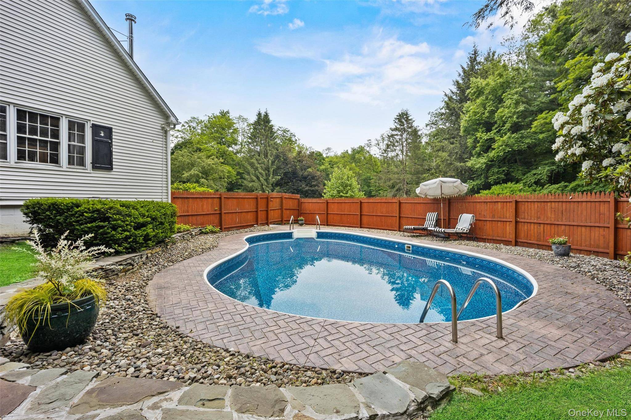 Welcome to 1056 Beekman Road a beautifully updated Cape Cod offering timeless charm and resort style living, available now for rent.