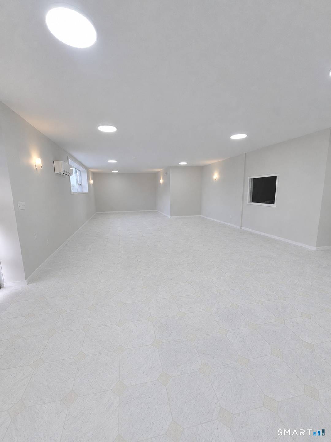 Newly renovated commercial space featuring elegant marble floors and a flexible layout ready to be customized to fit your business needs.