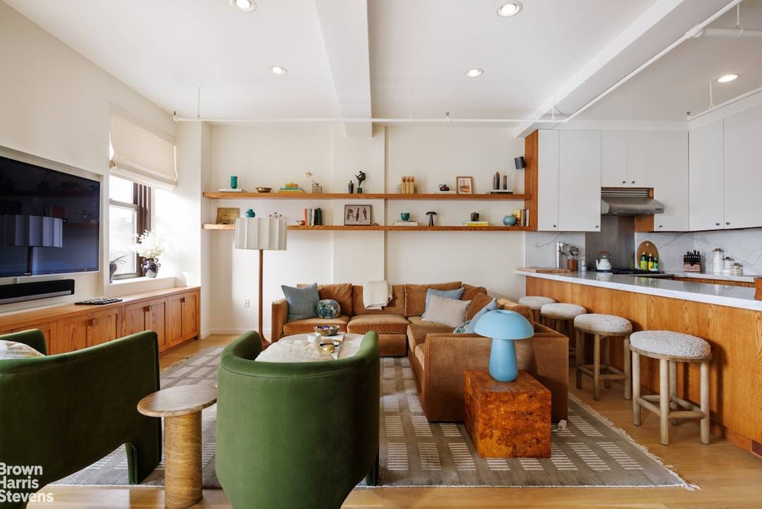 Featured in Architectural Digest, this impeccably curated 1, 306 square foot loft with private terrace was designed by Past Lives Studio.