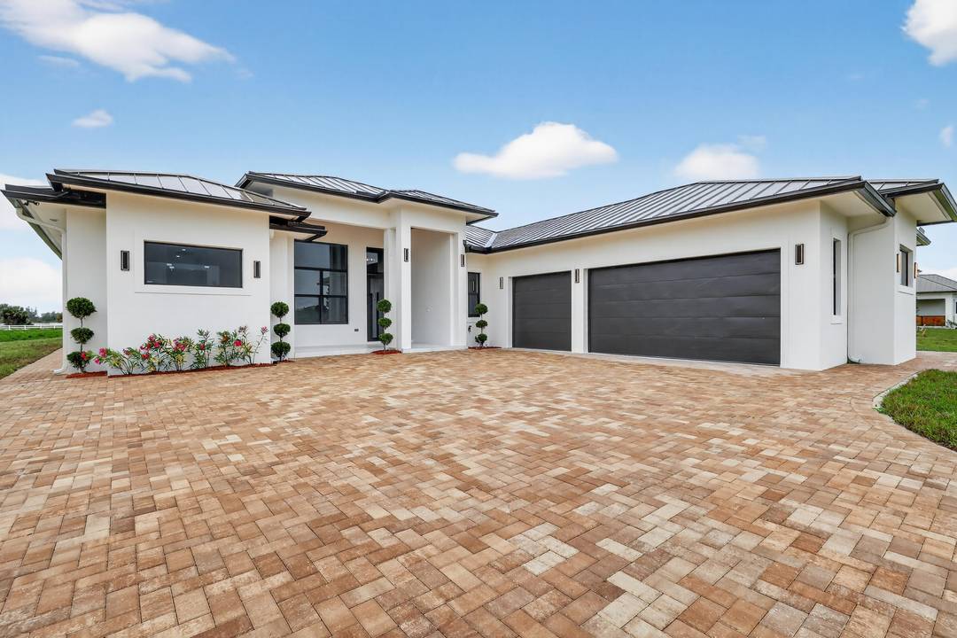 Exceptional new construction equestrian estate The property features single family home and a fully equipped horse facility with 12 stalls, rider's lounge with guest room, 1.