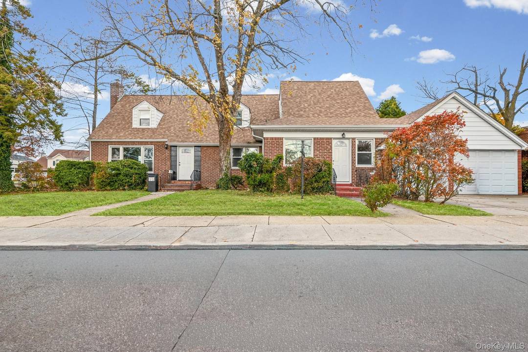 Exquisite 4 Bedroom Brick Home with Finished Basement on a Spacious Lot in the Heart of Valley Stream !
