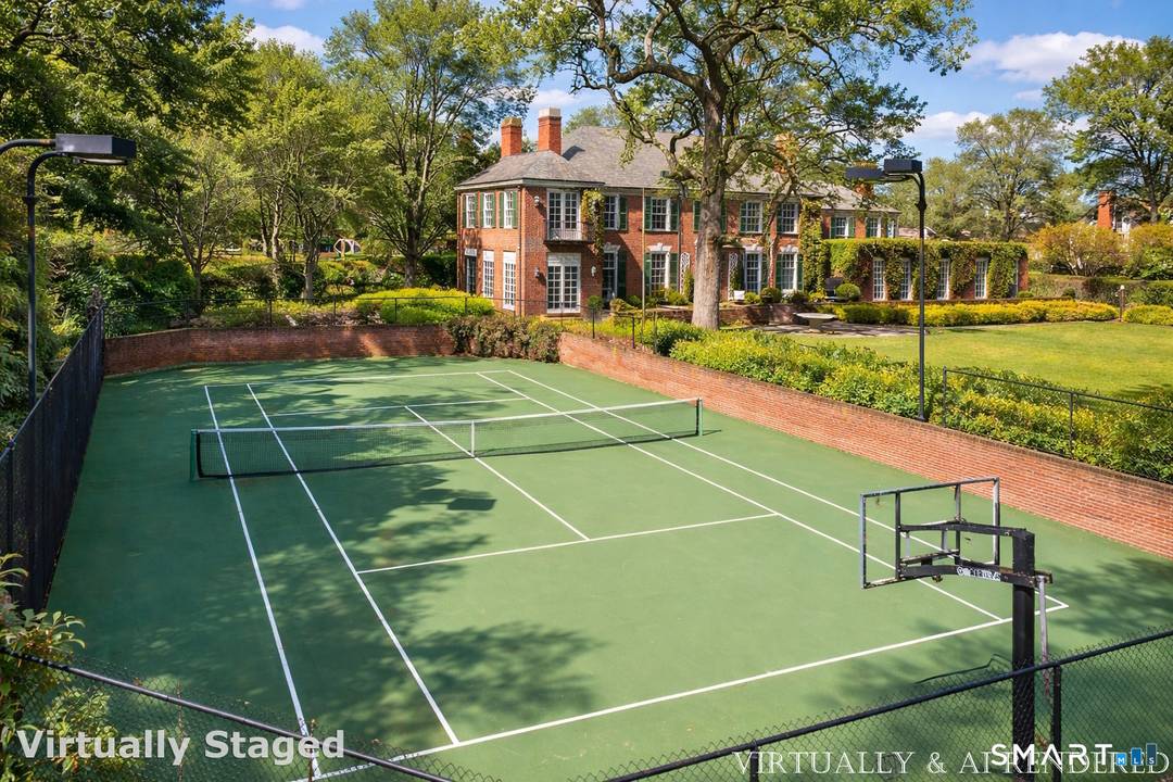 Iconic Georgian Manor. A rare offering of architectural significance, this distinguished 1922 Georgian Colonial is set on 1.