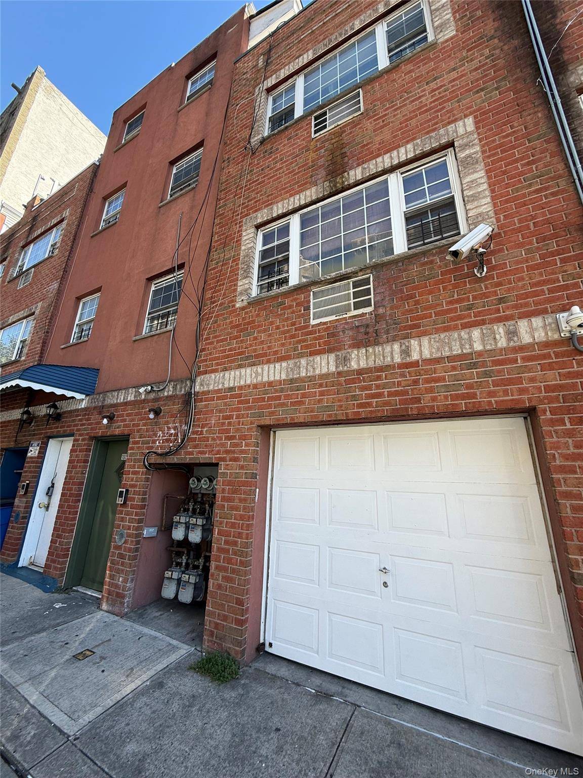 This amazing 3 family brick house is back on the market.