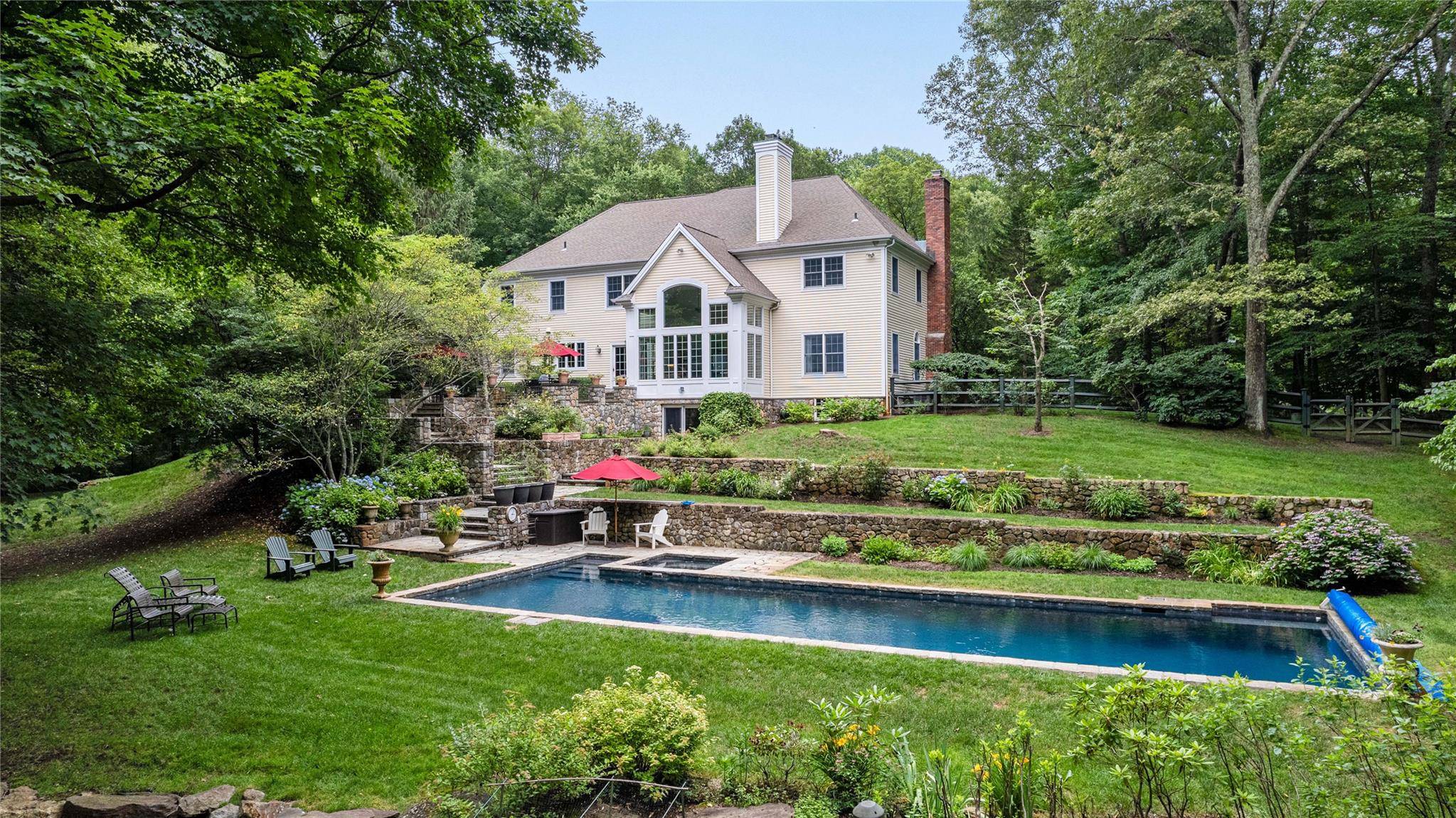 Welcome home to this beautiful colonial, perfectly situated in a spectacular private setting that backs up to the pristine Mianus River Gorge.