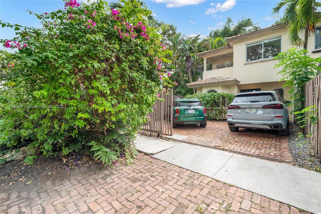 Nestled in the heart of Coconut Grove, this exquisite 3 bedroom, 2.