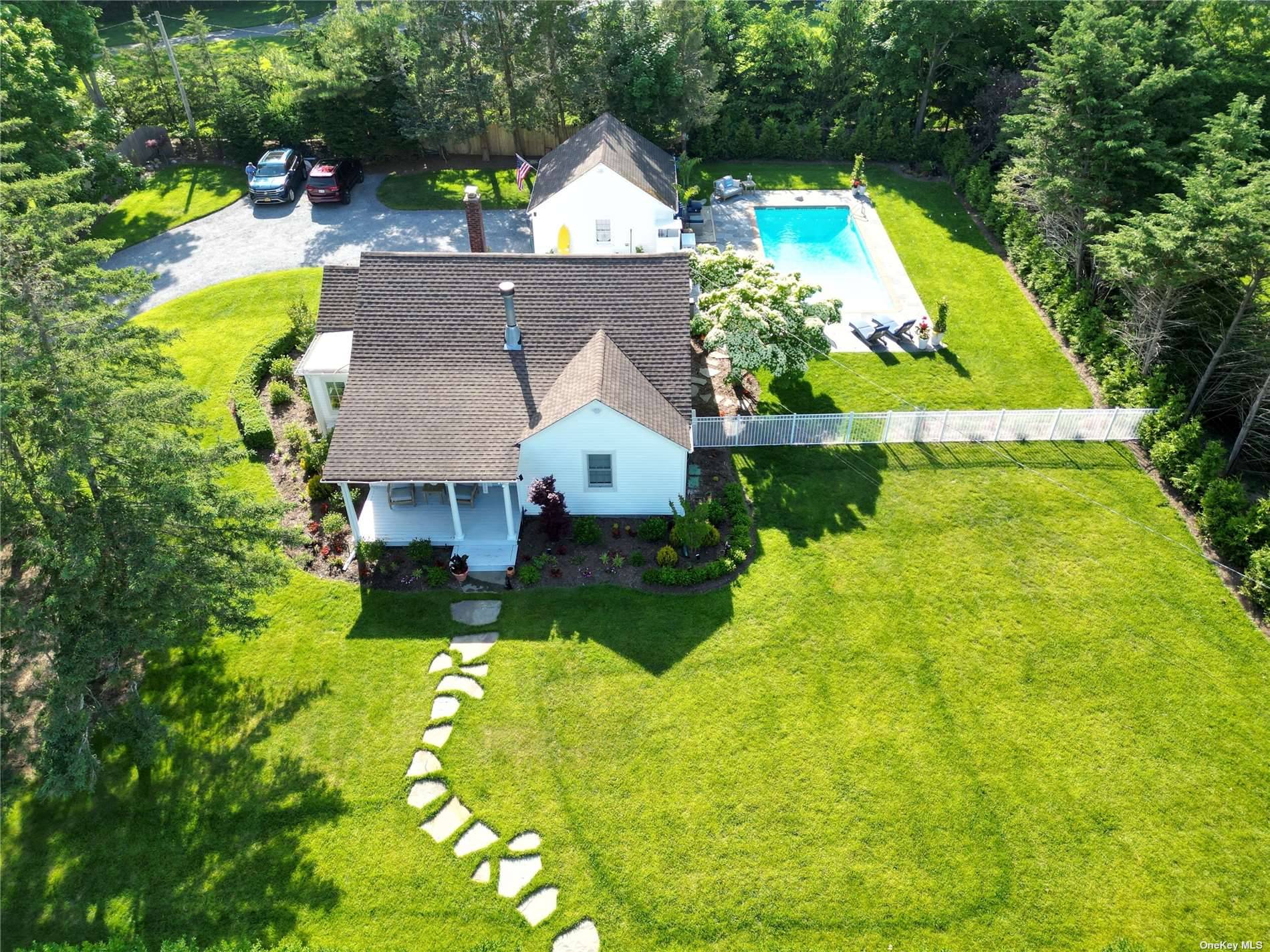 Summer is in full bloom at this charming Westhampton Beach cottage, located south of the highway and only.