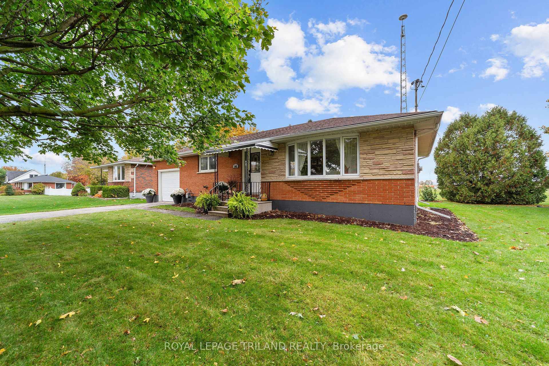 This well cared for bungalow with attached garage sits on an oversized lot and offers 2 bedrooms and 1.