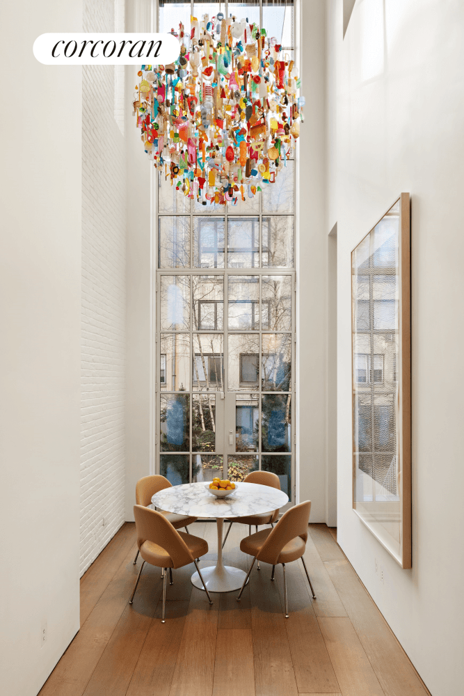 Experience the pinnacle of New York City living with this one of a kind, forty foot wide townhouse completely reimagined by renowned London based architect Guy Stansfeld.