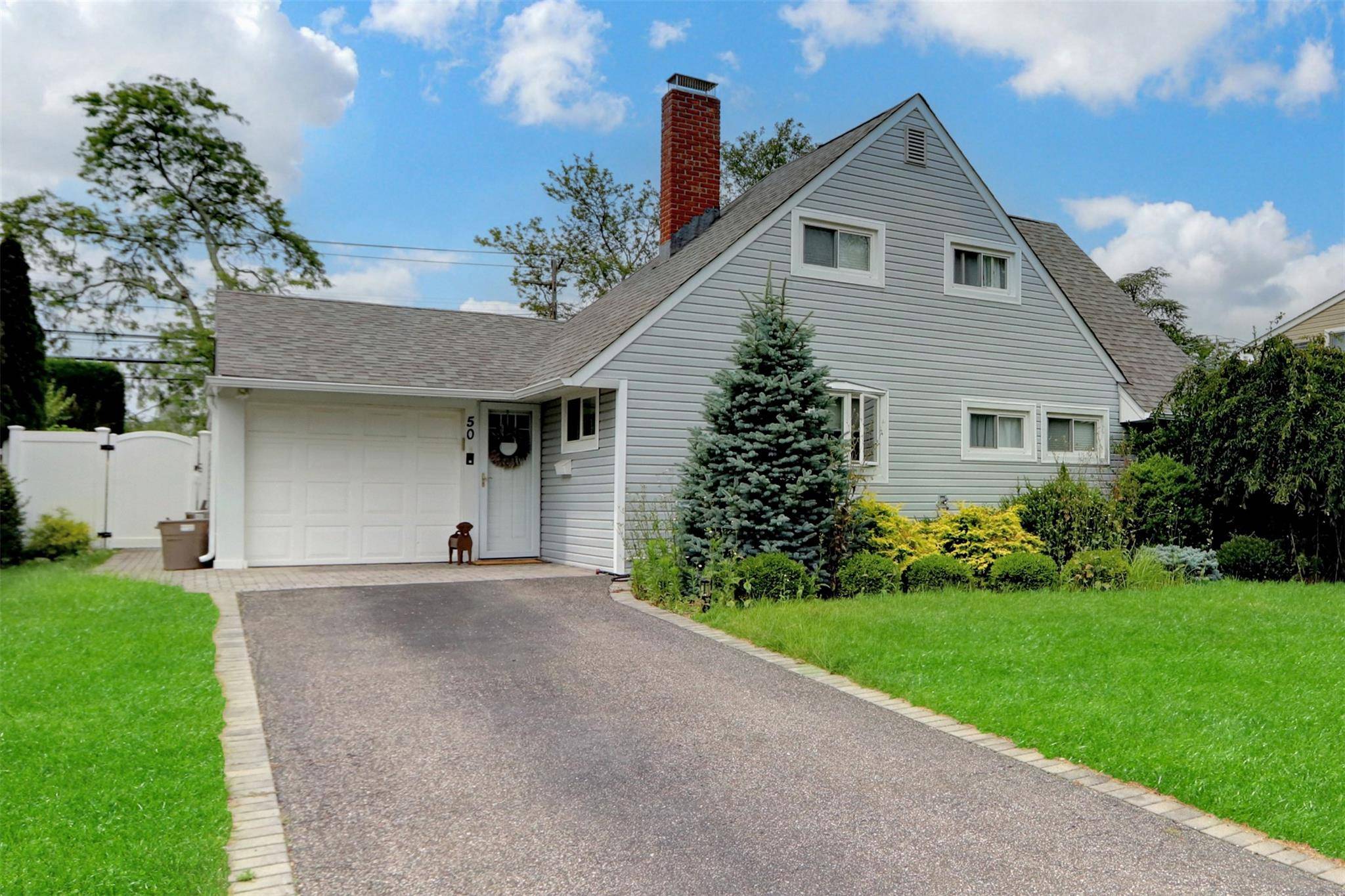 Welcome to your dream home in the highly sought after Salisbury neighborhood of Westbury a rare gem nestled directly among the fairways of the prestigious Eisenhower Park Golf Course.