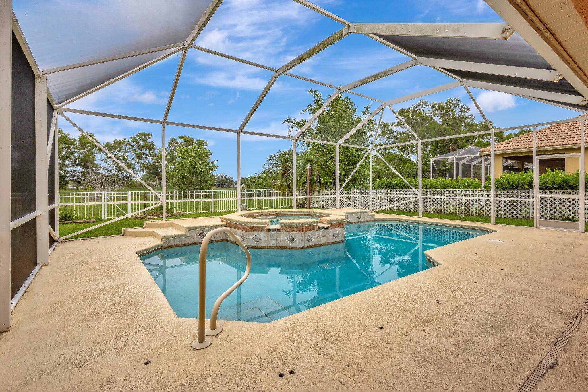 Enjoy this spacious 4 Bedroom, 3 Bath, 2 Car Garage Pool Home in the desirable gated golf community of St.