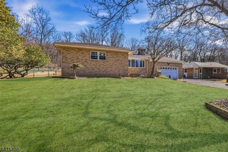 Welcome home to this charming brick front expanded ranch located in the desirable community of Bridgewater NJ.